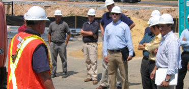 engineers and workers in construction site